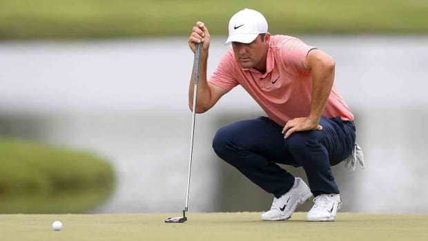 Scottie Scheffler plans out his putt on the 12th hole during the first round of the 2023 FedEx St. Jude Championship at TPC Southwind in Memphis, Tenn.